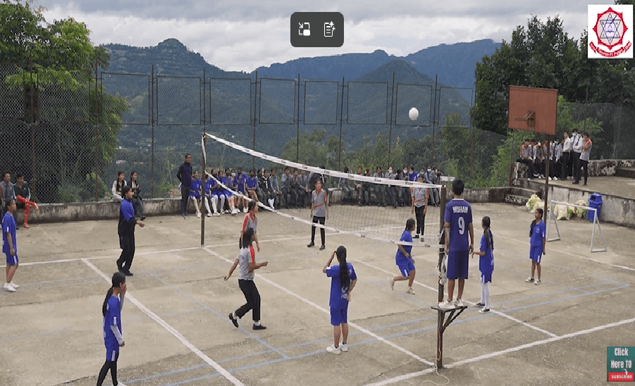 Students playing on the volleyball court